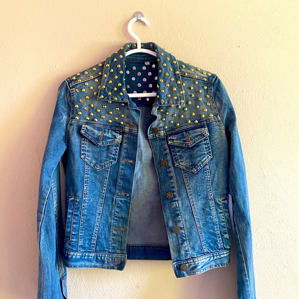 Denim jacket with gold spikes